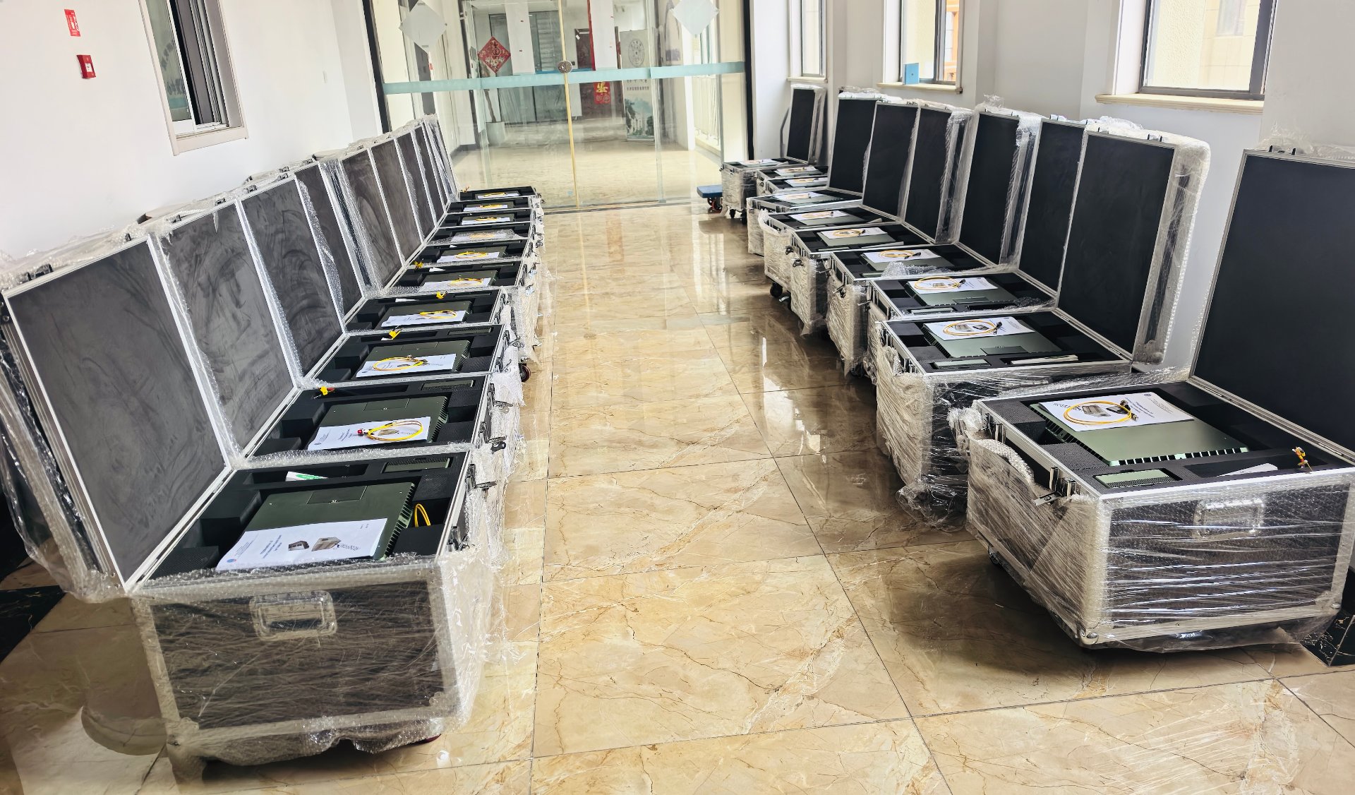 Batch-packed tethered power stations in transport cases prepared for container loading